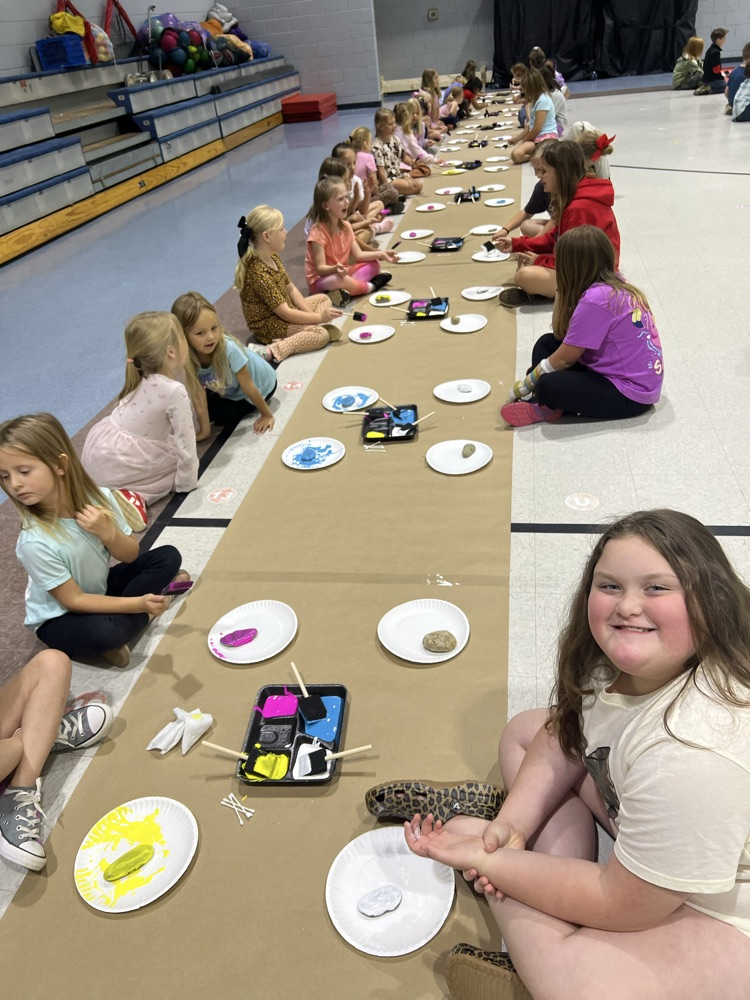 students painting rocks