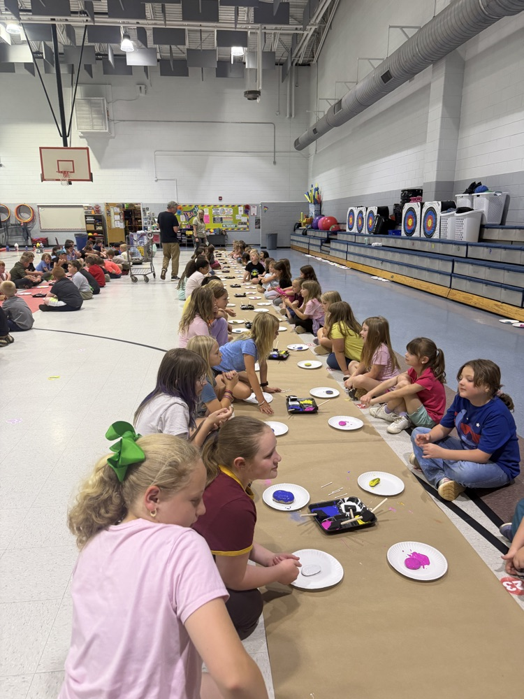 students painting rocks