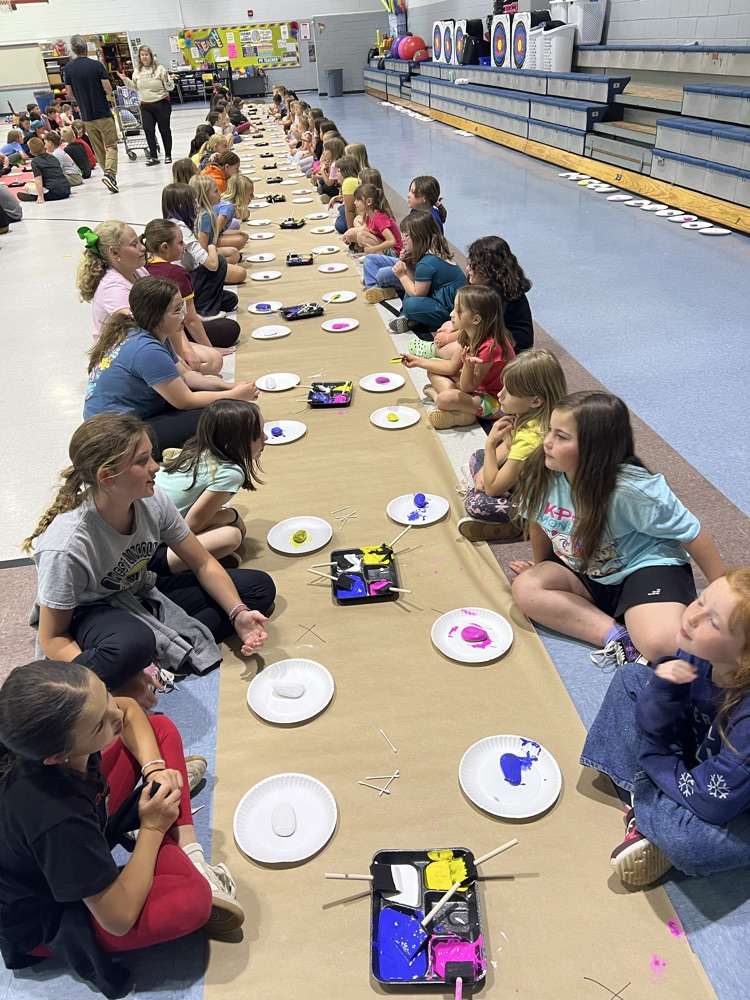 students painting rocks