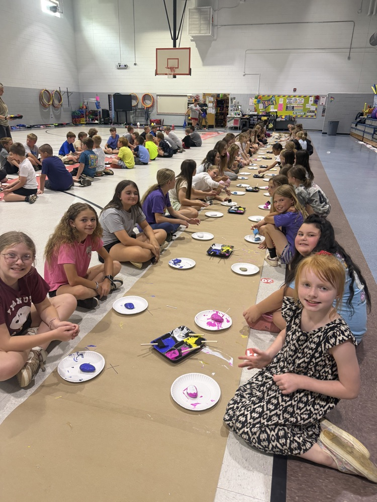 students painting rocks