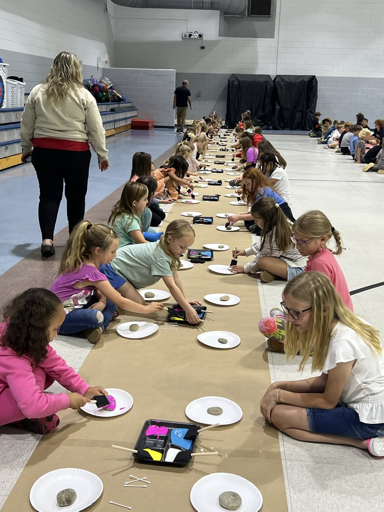 students painting rocks