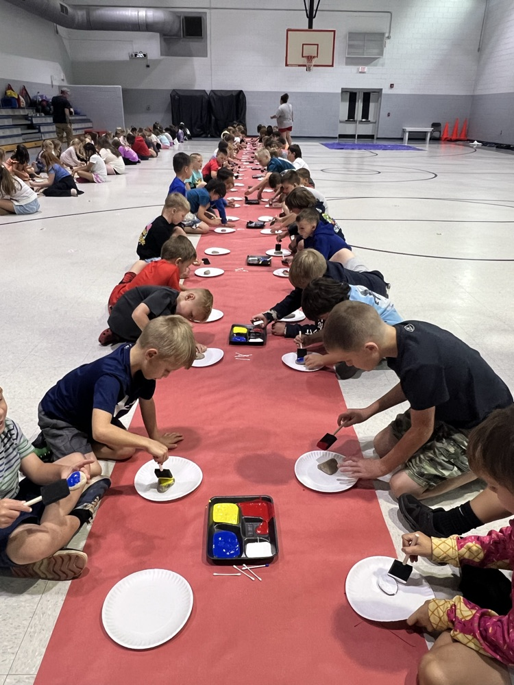 students painting rocks