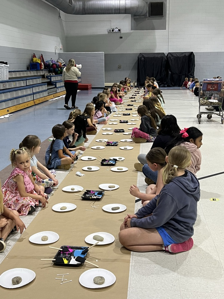 students painting rocks