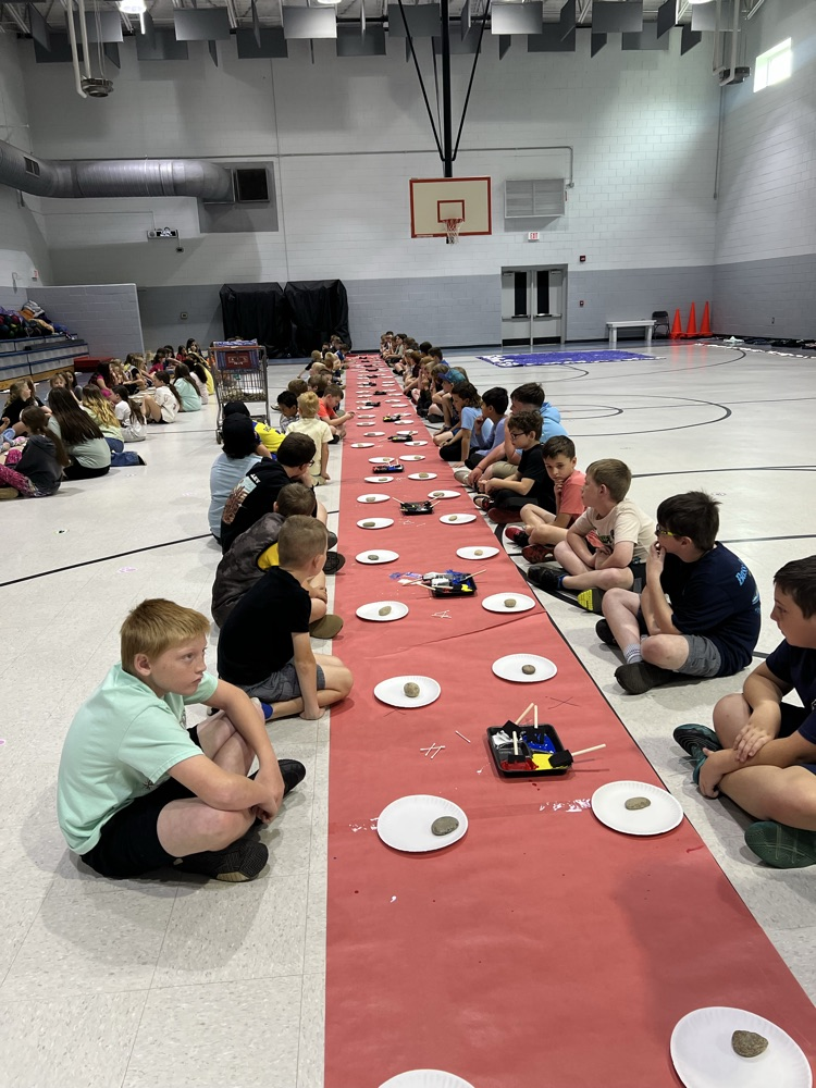 students painting rocks