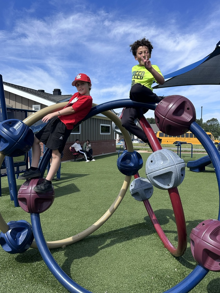 two boys climbing 