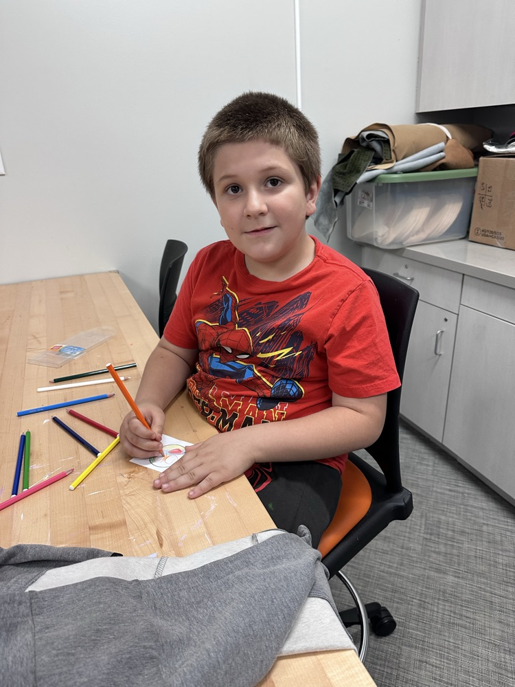 designing his own magnetic in the maker space at west Lincoln library