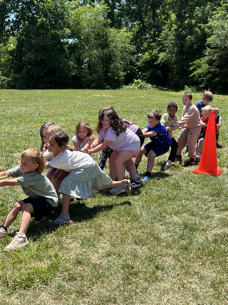 students outside playing tug a war