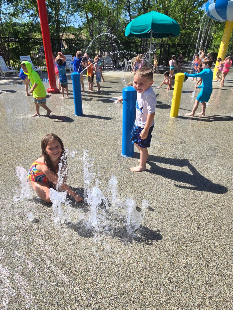 kids playing in water at a splash pad
