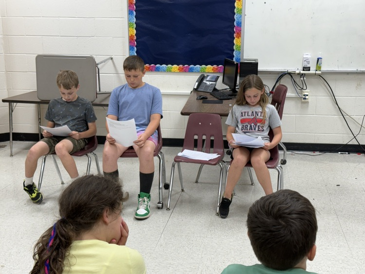 Fourth grade students present a mock courtroom trial.