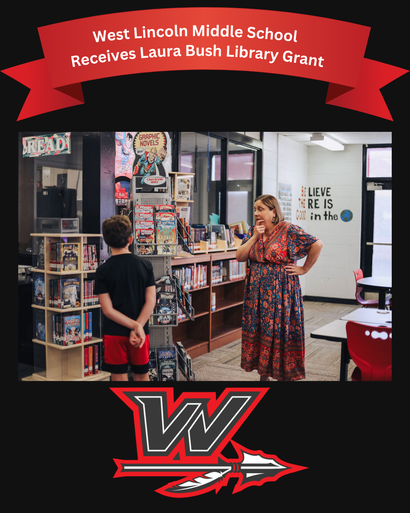 A school library with a woman and a boy. A woman stands with hands on hips, and a boy stands next to a shelf.