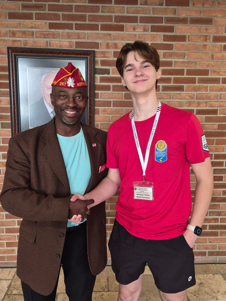 Matthe Smith shaking hads with NC Legionnaire Jerry McClough.