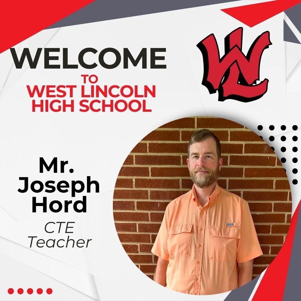 A man stands in front of a brick wall with a West Lincoln High School banner and logo.