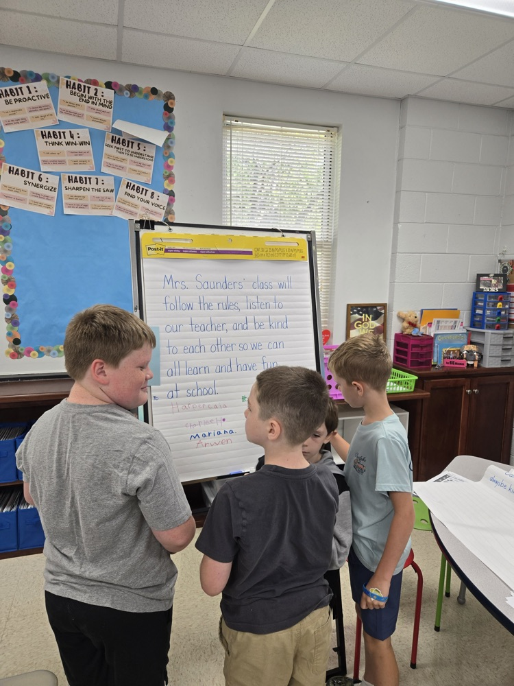 Mrs. Saunders class signs their class mission statement  