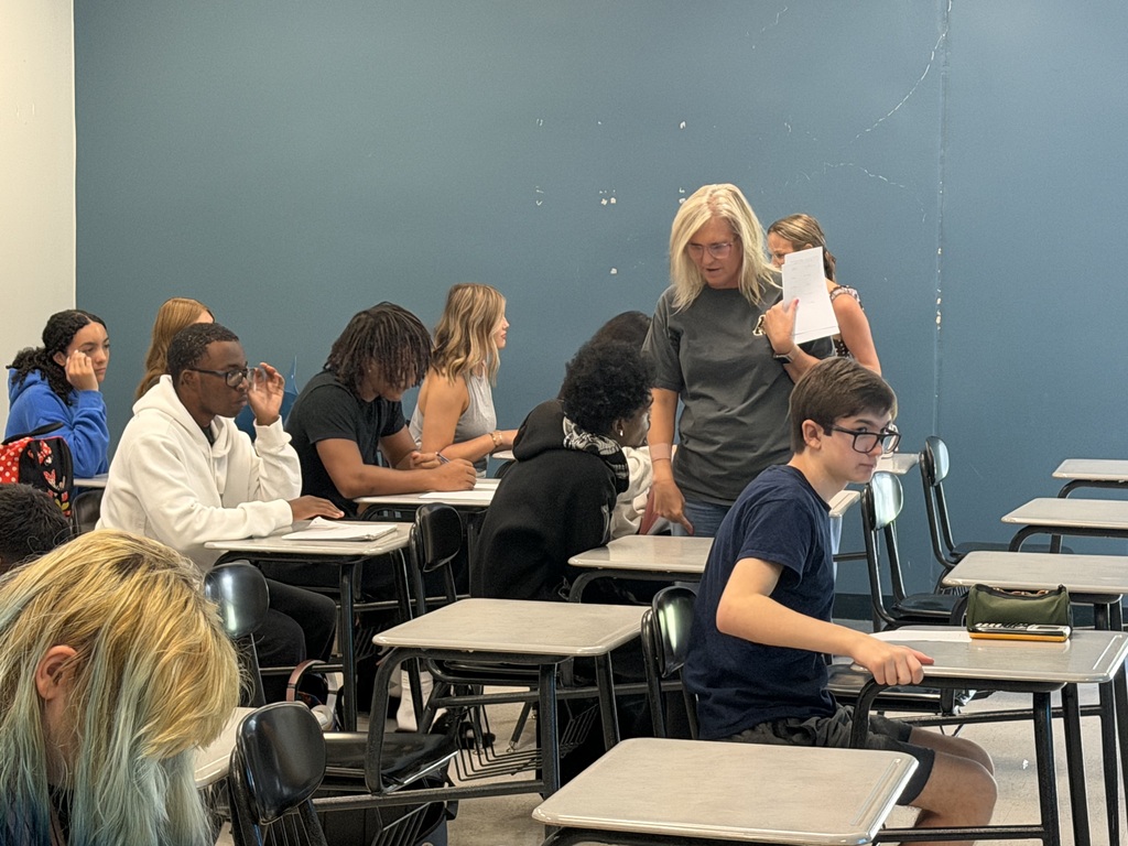 Students and teachers engaging in learning at NLHS