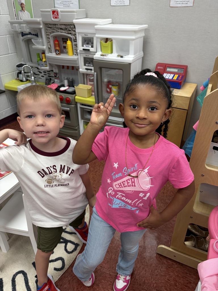 two kids a boy and girl smiling 