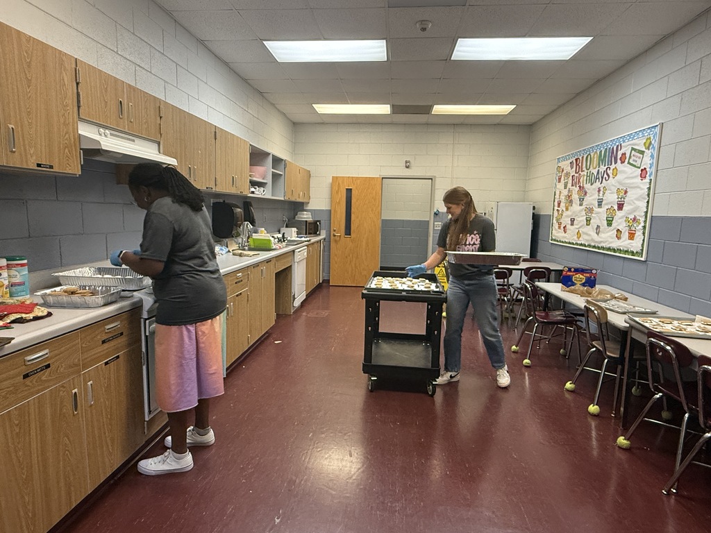 PTO volunteers prepare S'more treat for staff and students.