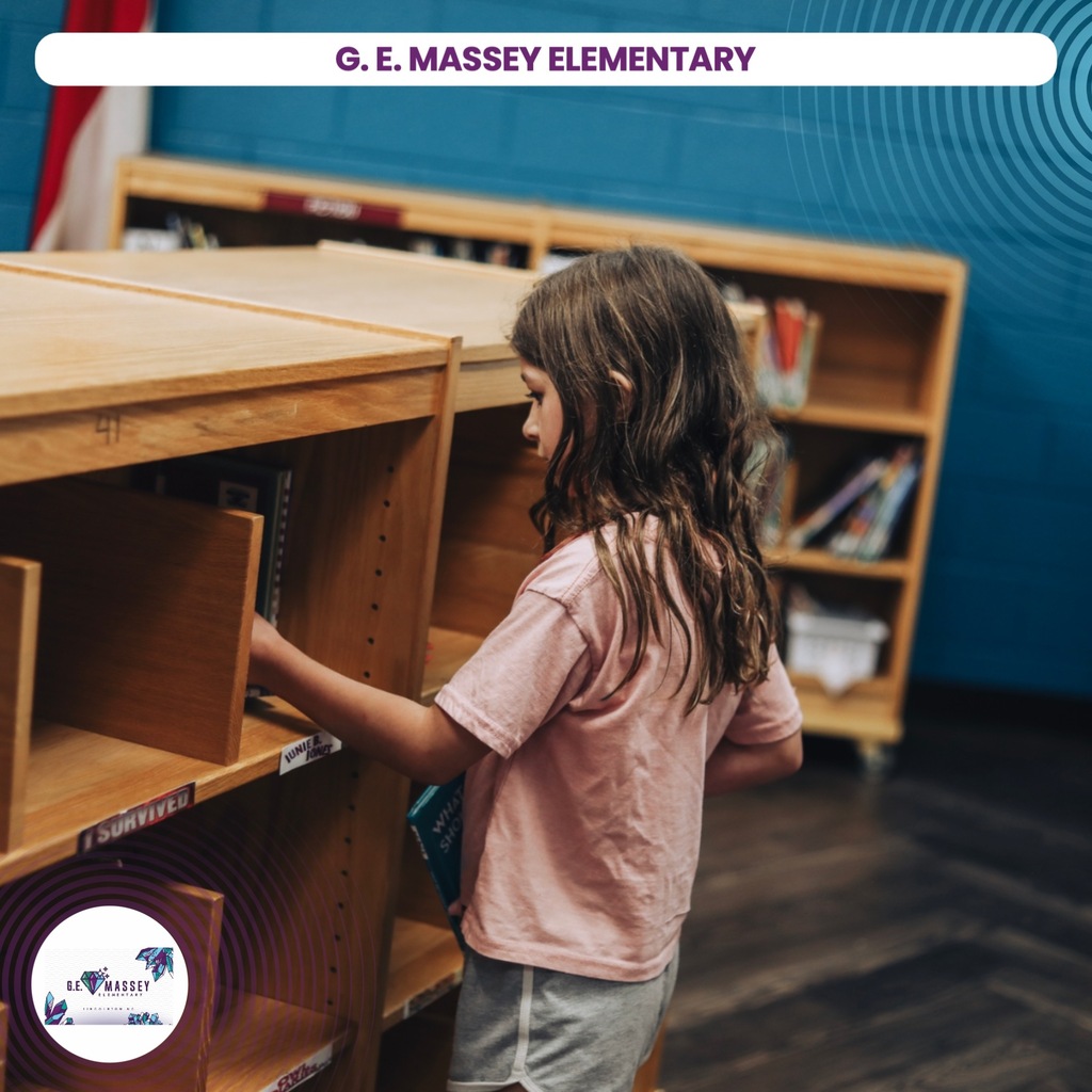 A girl with long hair reaches into a library shelf with wooden cabinets and blue walls.