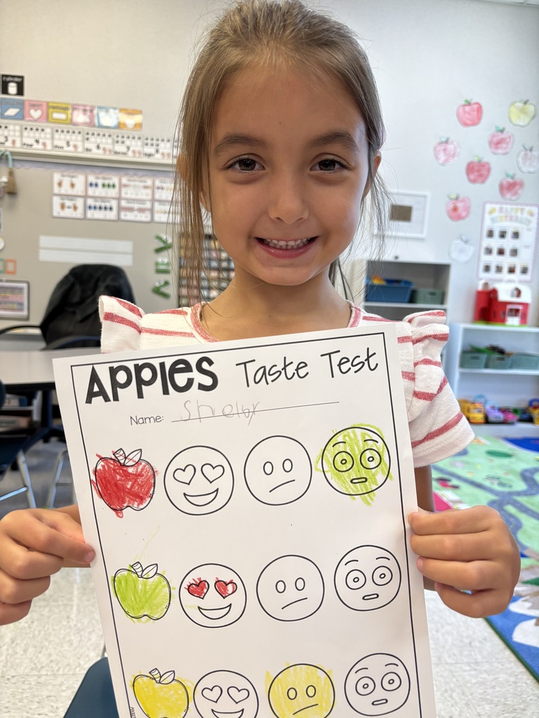 Kindergartners learning about apples