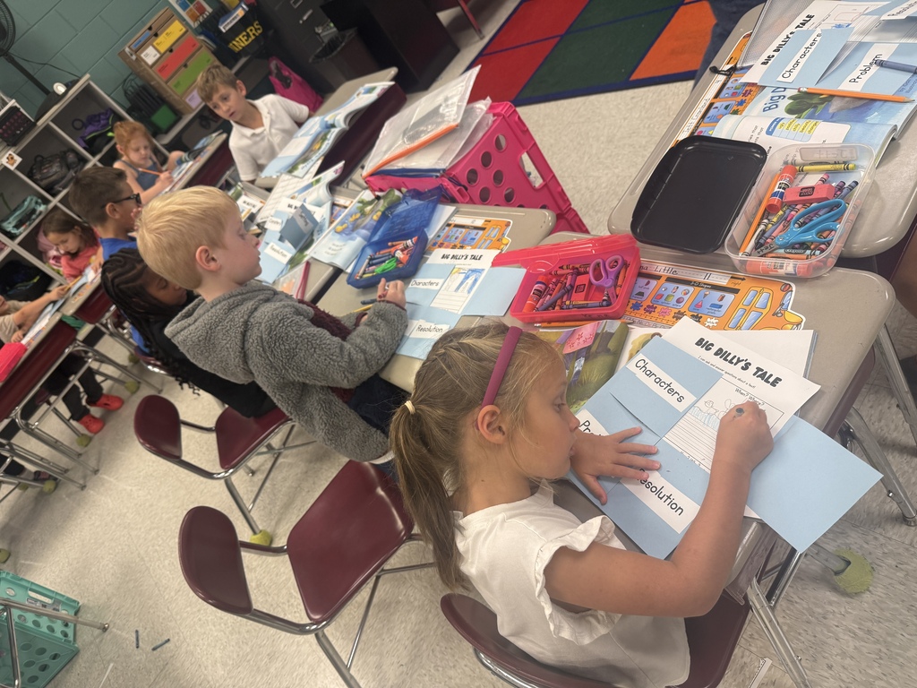 Students working on the setting of the story.