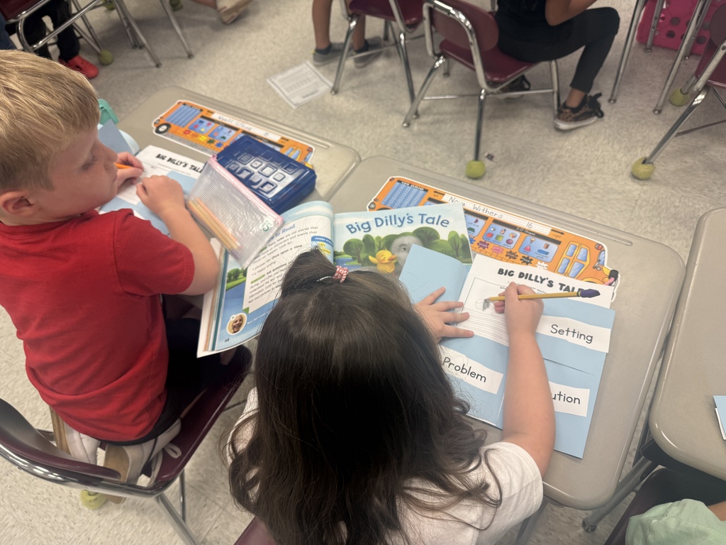 Students working on their illustrations of the characters in the story.