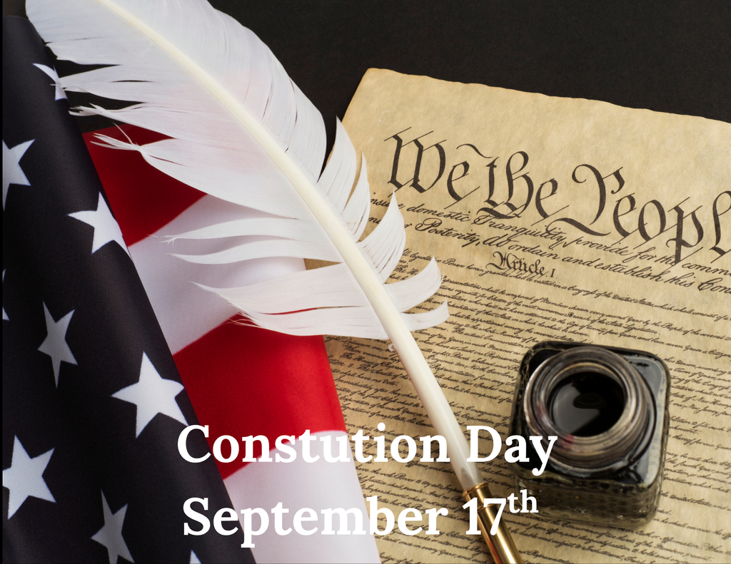 A quill, American flag, and parchment with "We the People" text on a black background. Caption: "Constitution Day September 17th"