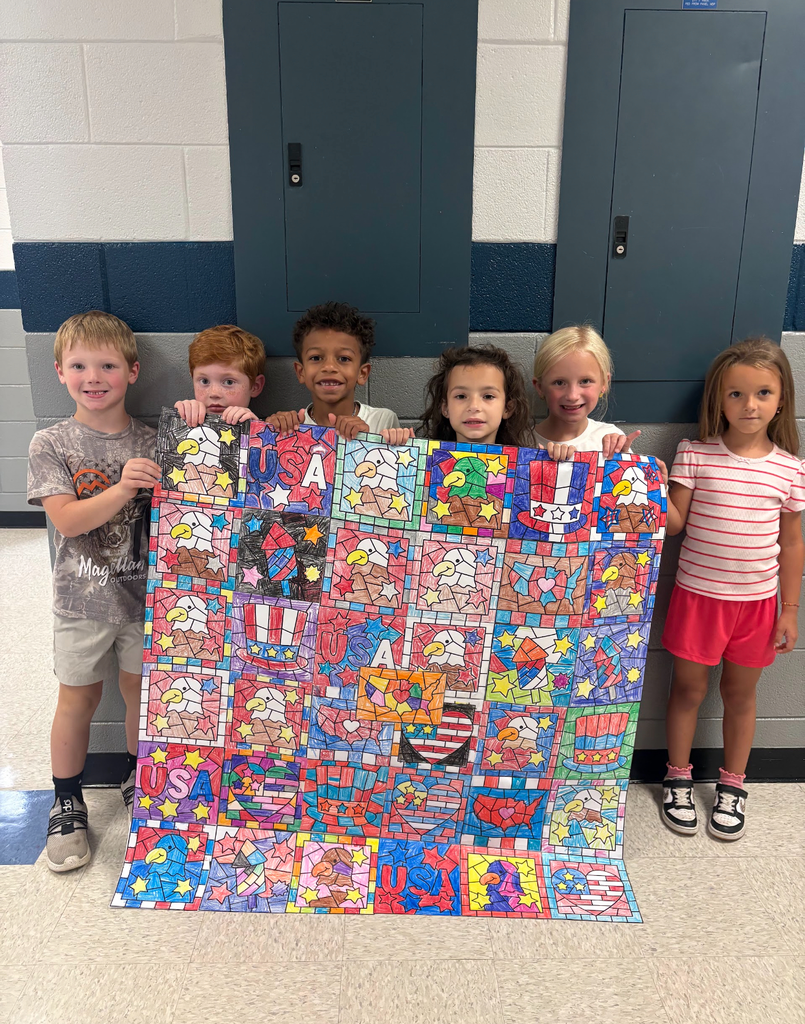 Five children hold a colorful quilt with images of American flags, stars, hearts, and a basketball.