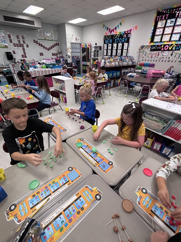 Students use Play-Doh and toothpicks to building models of 3D shapes.
