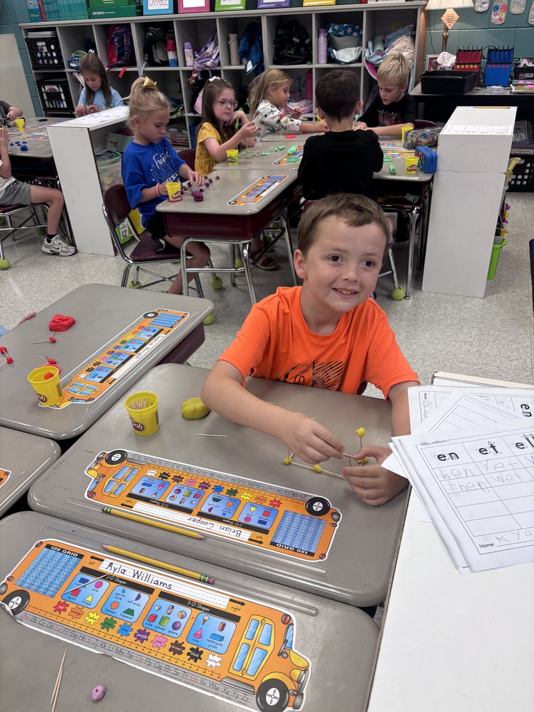 Students use Play-Doh and toothpicks to building models of 3D shapes.