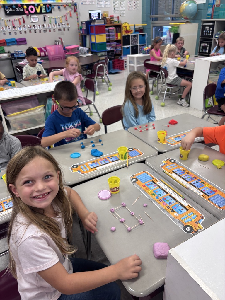 Students use Play-Doh and toothpicks to building models of 3D shapes.
