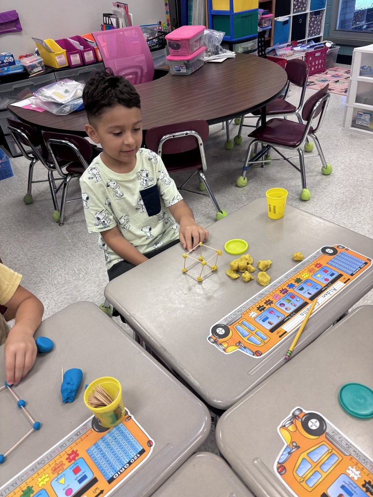 Students use Play-Doh and toothpicks to building models of 3D shapes.