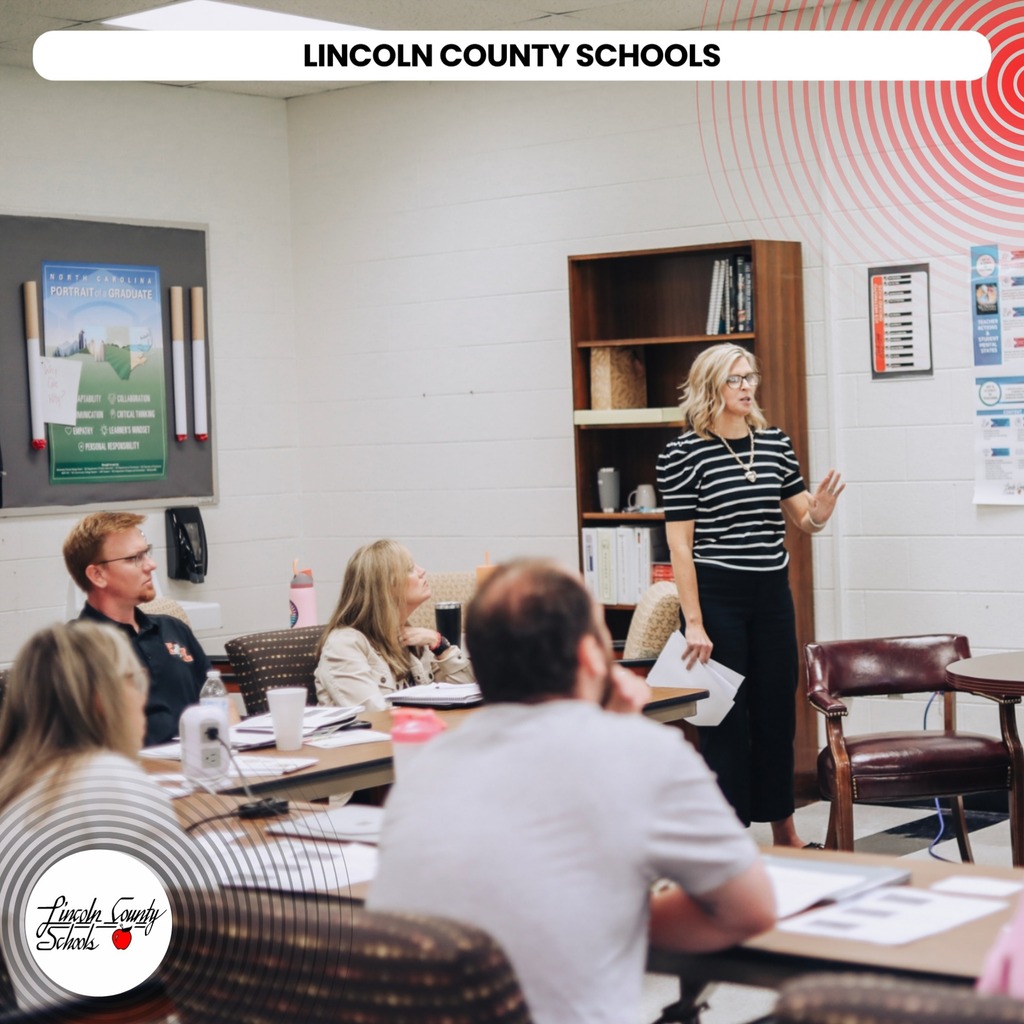 A woman stands in front of a classroom with a group of people seated. A text overlay reads "Lincoln County Schools".