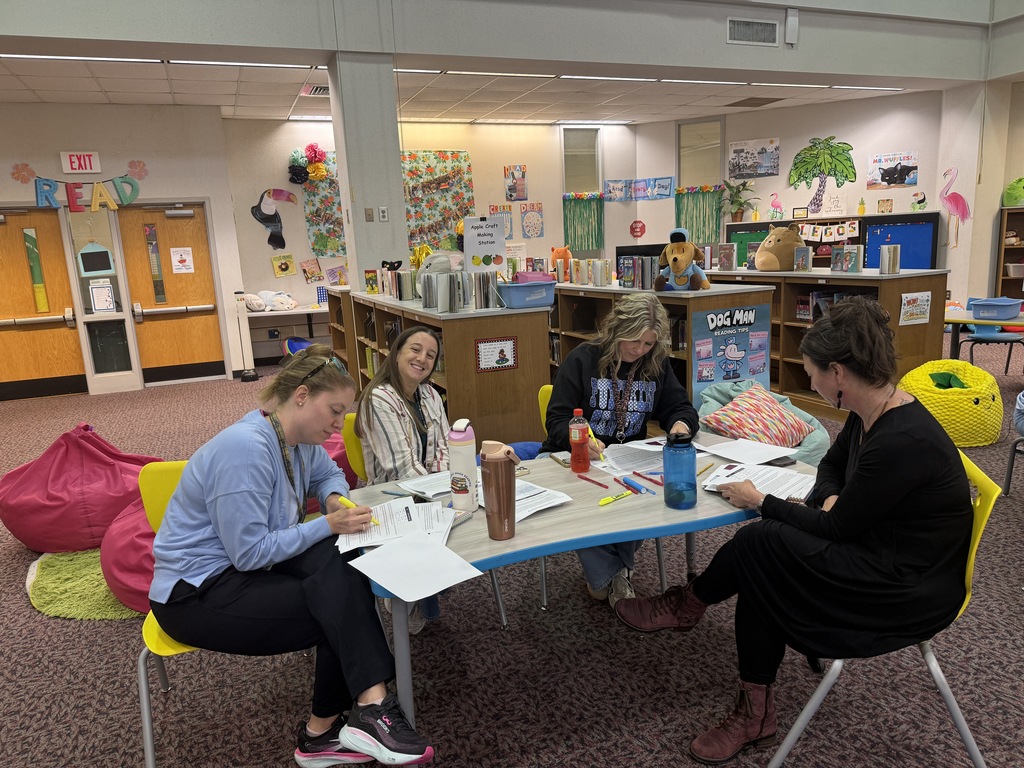 Staff participating in a professional development during monthly staff meeting.
