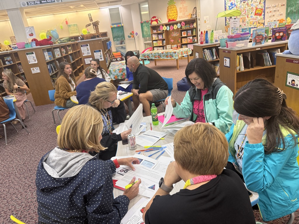 Staff participating in a professional development during monthly staff meeting.