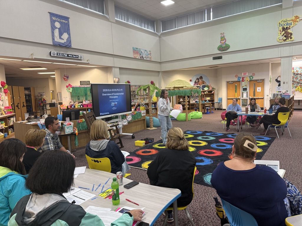 Staff participating in a professional development during monthly staff meeting.