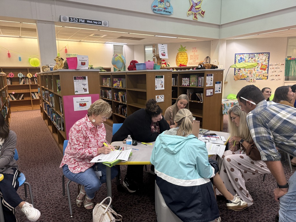 Staff participating in a professional development during monthly staff meeting. 