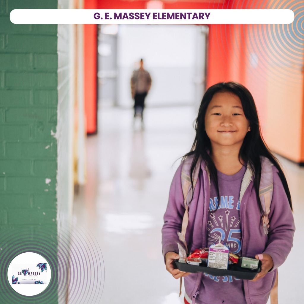 A smiling girl holds a tray with food, wearing a purple jacket. Behind her, a school corridor with a green wall.