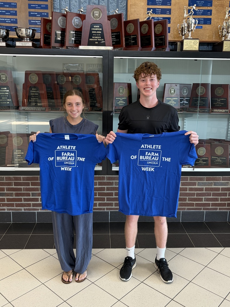students standing with shirts