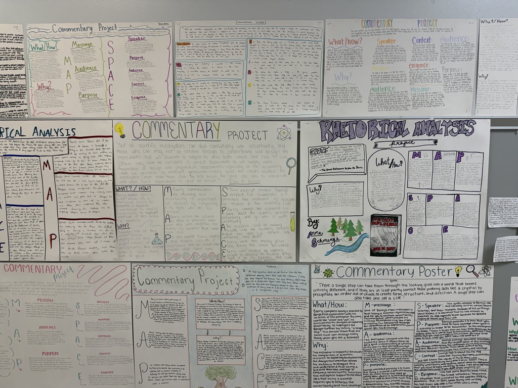 A collection of diverse documents, charts, and handwritten notes pinned to a bulletin board with a gray background.