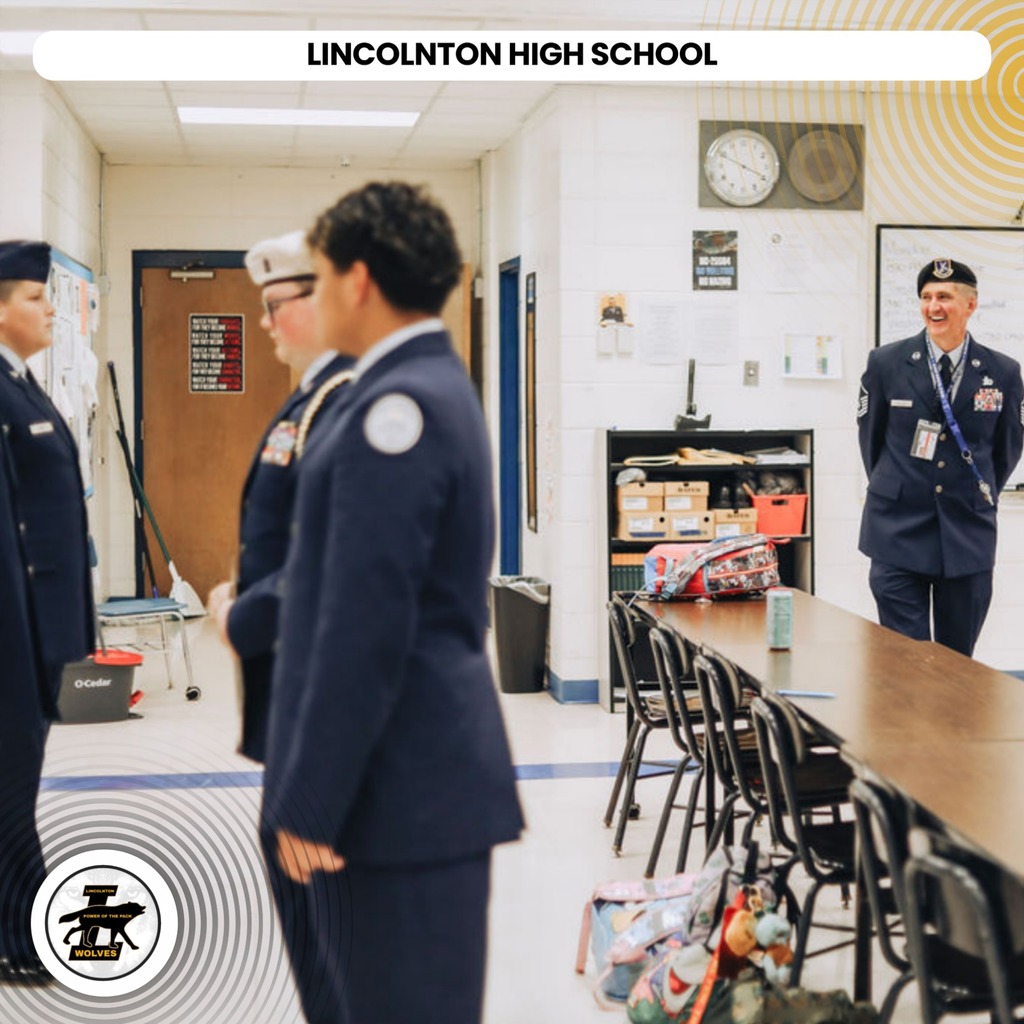 Five individuals in navy blue uniforms stand in a room with a clock and a whiteboard. The text reads "LINCOLNTON HIGH SCHOOL".