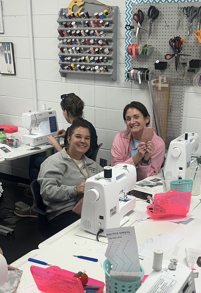 Showing their sewing project