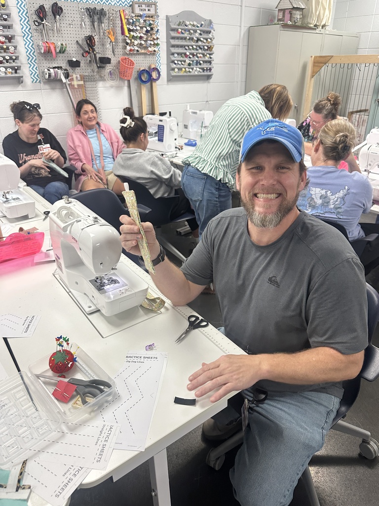 Teacher with a finished sewing project