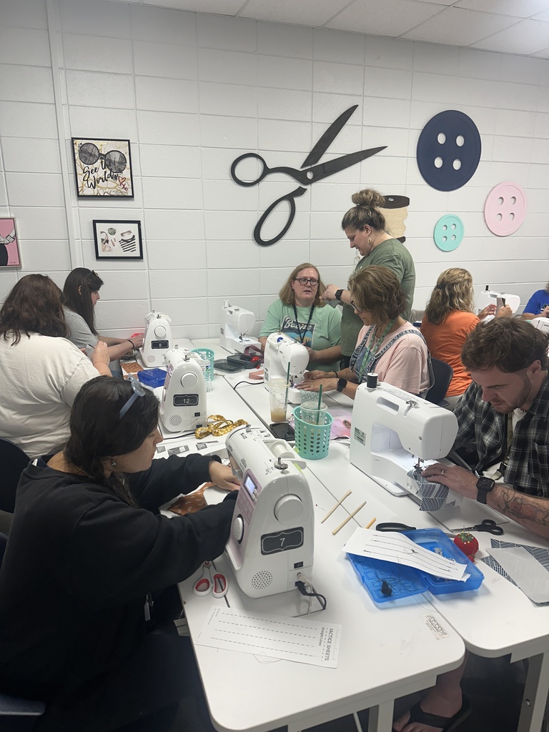Teachers focused on sewing