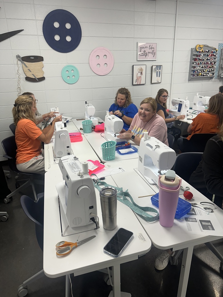 Teachers focused on sewing