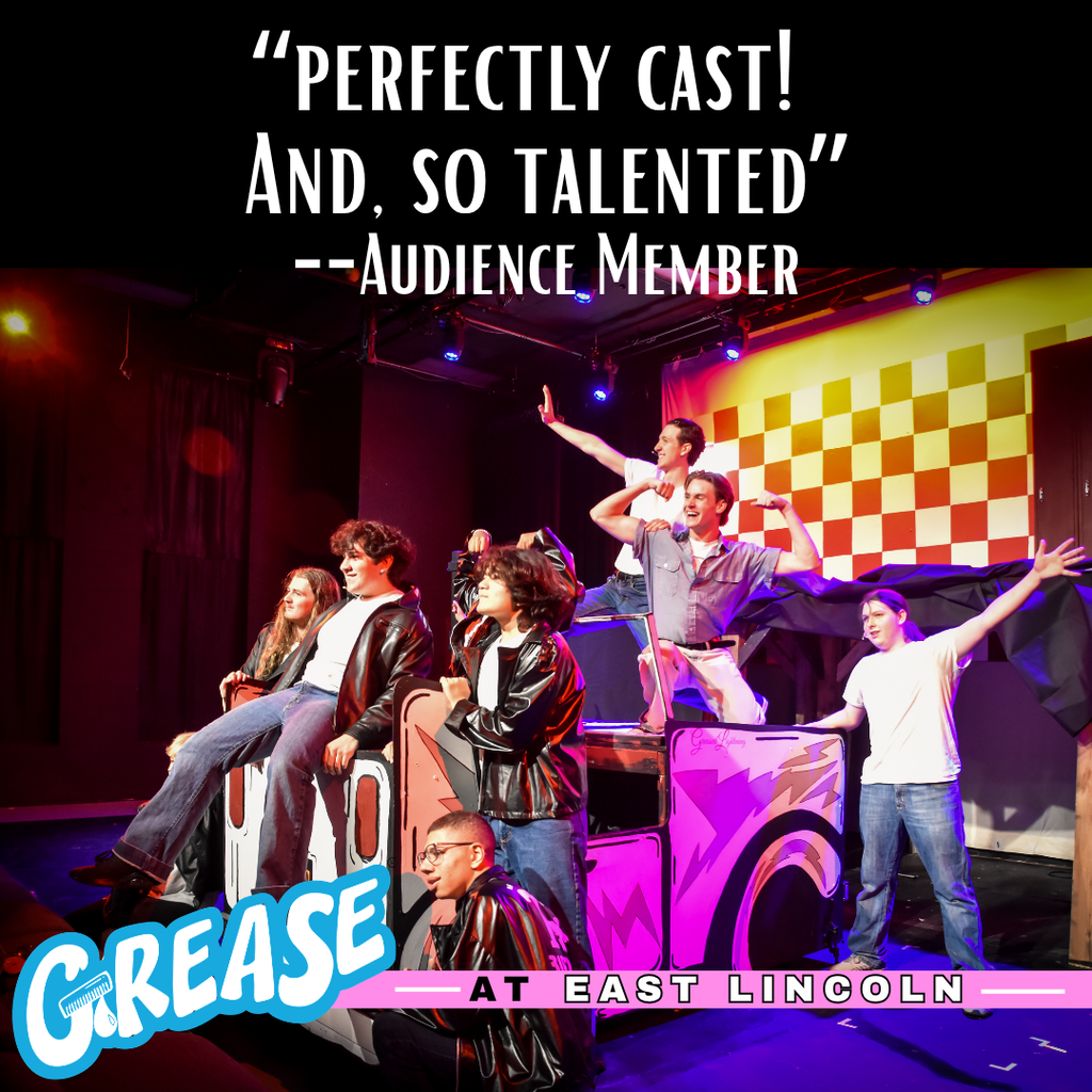 Audience members watch a performance of Grease on stage with a checkered background. Performers are in various poses, including arms outstretched.