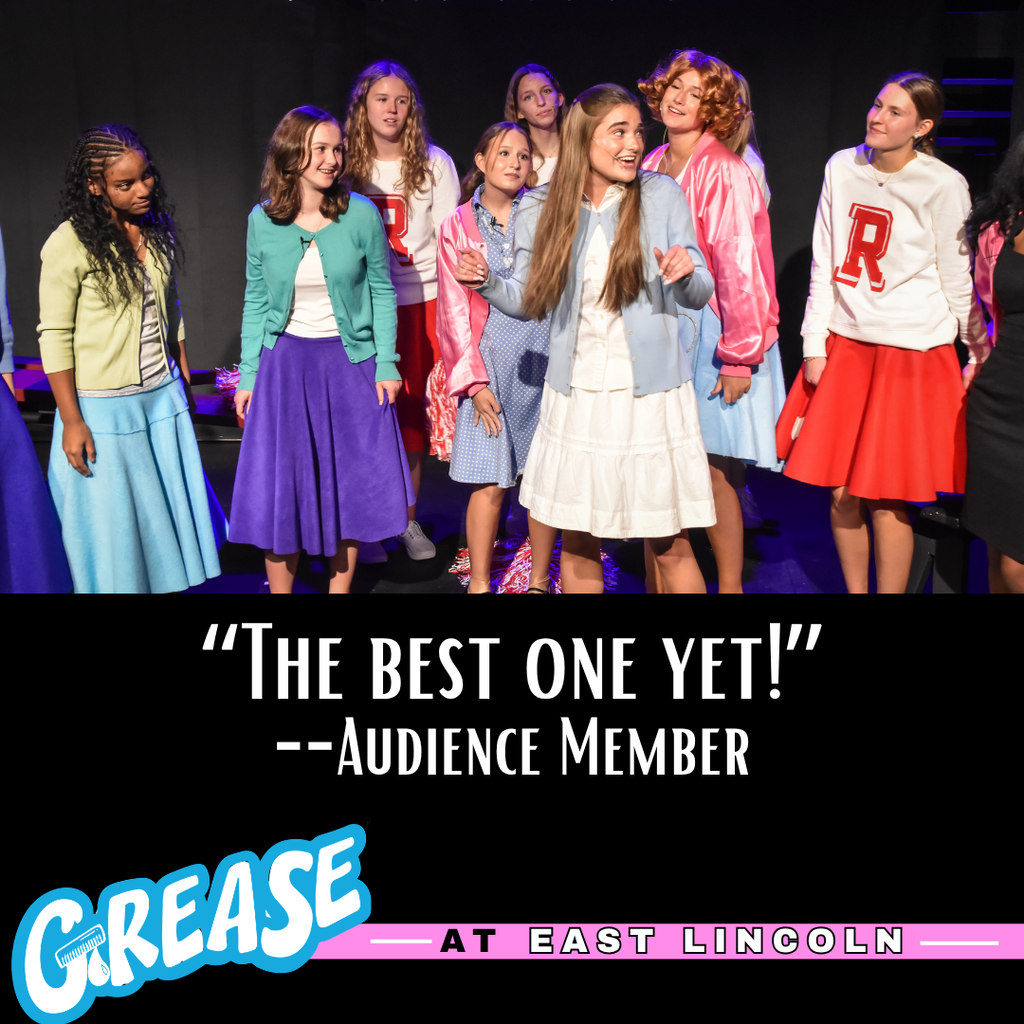 Nine girls on a stage in a theater, wearing 1950s-style clothing, facing the audience.