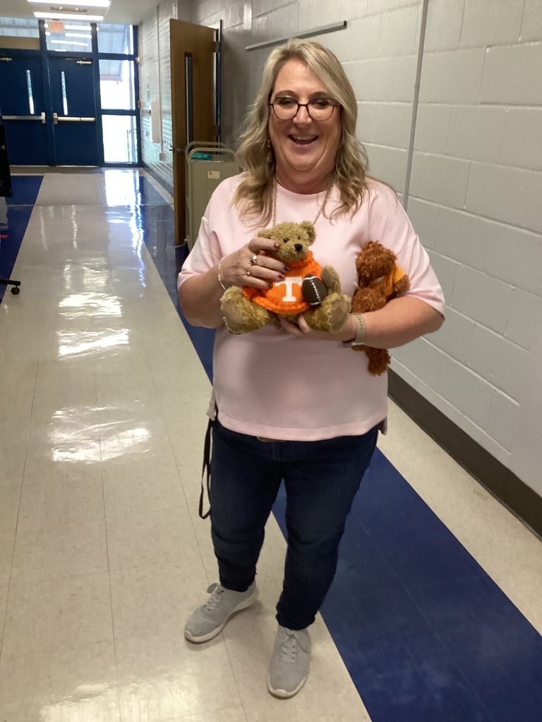 Mrs. Christy is all smiles with her teddy bears on Teddy Bear Day at LCA!