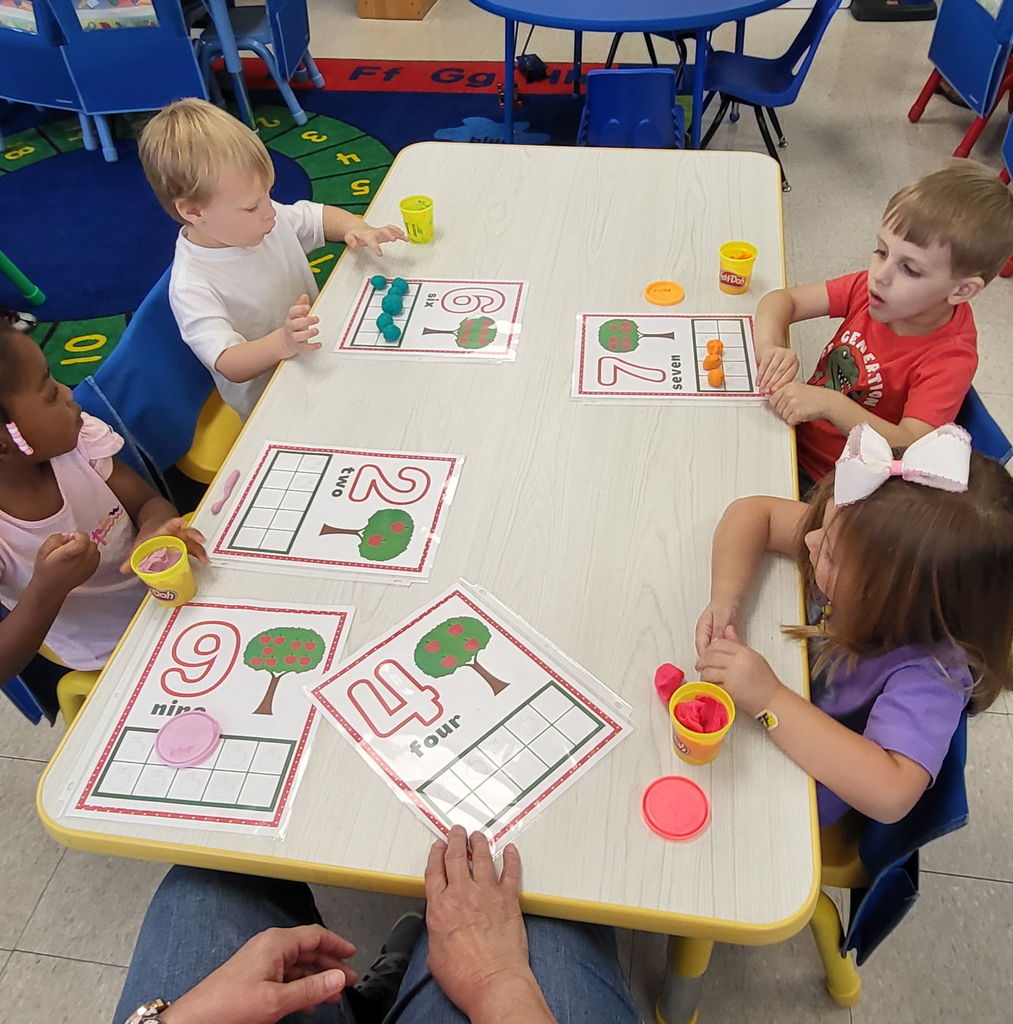Pre-K 3 is working with numbers and Play Doh!