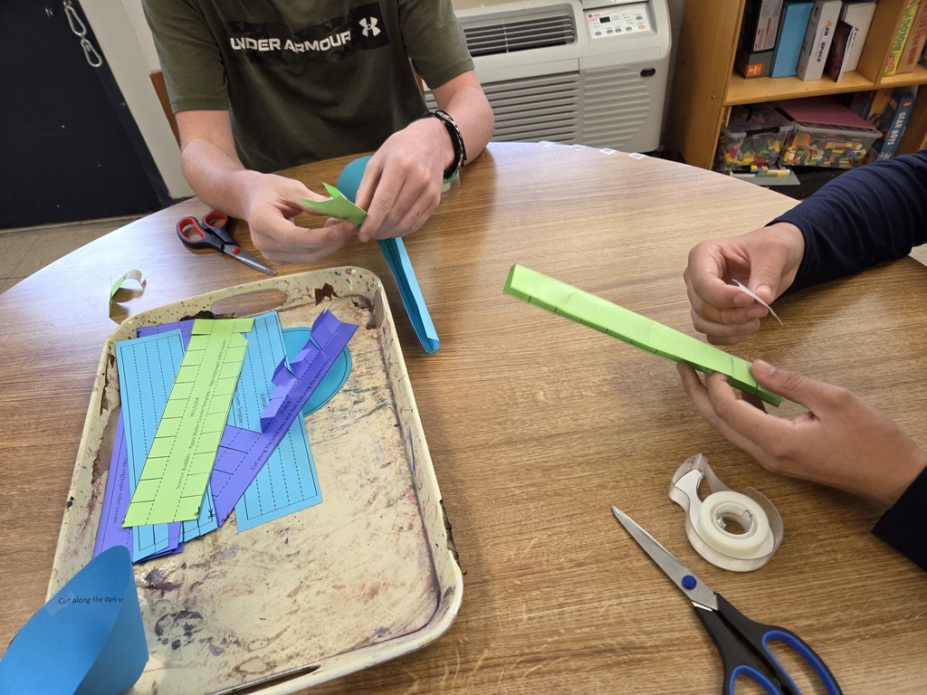 FAA students working together building roller coasters.