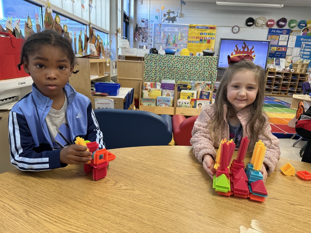Kids making pretend fire fighters🧑🚒 and fire trucks 🚒 with our classroom manipulatives.