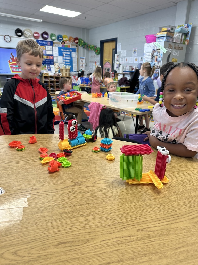 Kids making pretend fire fighters🧑🚒 and fire trucks 🚒 with our classroom manipulatives.